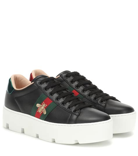 black gucci aces white sole|gucci ace leather shoes.